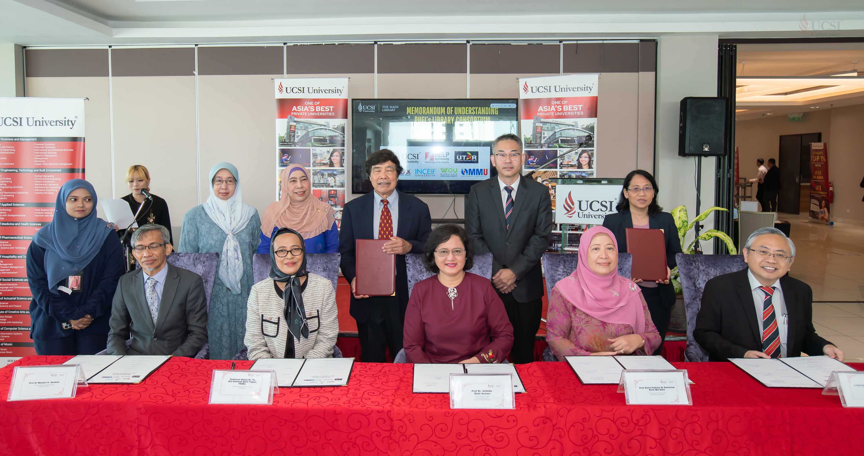 Strategic partnership: Prof Datuk Dr Siti Hamisah Tapsir (fifth from left) and Prof Dr Azlinda Azman (sixth from right) with academic members of participating universities during the MoU signing ceremony.