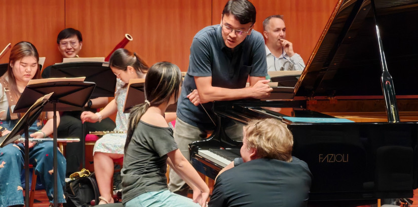 Rehearsing and getting some advice for the concert.