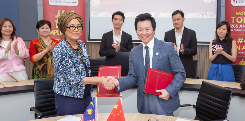 Forging new musical partnerships: UCSI University vice-chancellor and president Prof Emerita Datuk Ts Ir Dr Siti Hamisah Tapsir (left) and Tianjin Conservatory of Music president Wang Hongwei (right) formalise their partnership with a signed MoU.