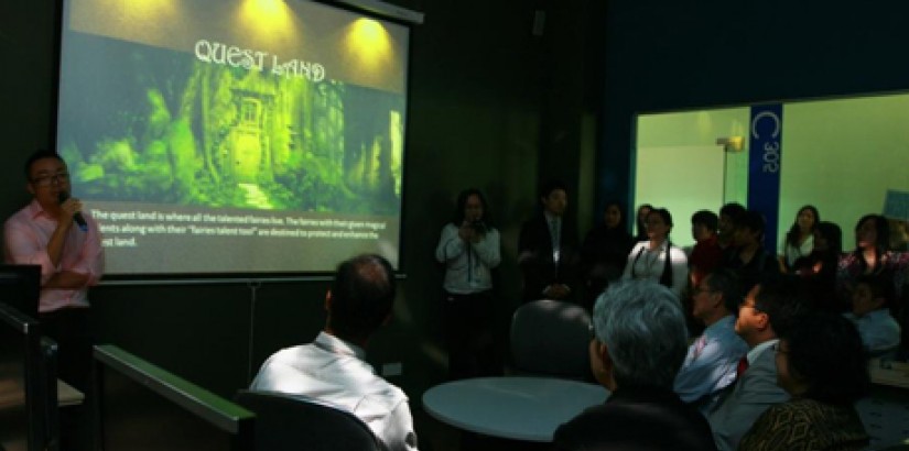 3D Animation lab lecturer, Mr. Ivan Lam (standing far left) briefs the audience on the journey the staff and students had undertaken to create “Quest Land”