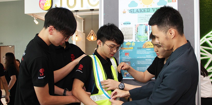 Students demonstrating the use of the “Slaked Vest”.