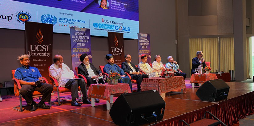 The moderator and panellist at the Forum.