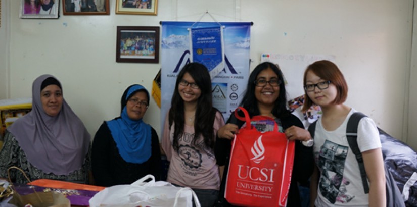 A GIVING HEART: Head of the A-Level Academy Dr Nalina AP Thurairajah (second from right) posing with the donated gifts together with SALSA students and staff of a shelter home.