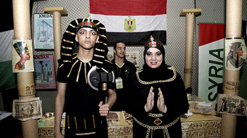  GLORIOUS: Students standing proud in front of their booth showcasing the unique qualities of their country.