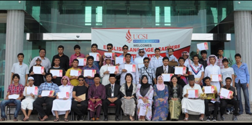 Summer 2012's Intensive English Programme participants posing for a group photo with teachers and camp discipline masters after receiving their certificate of completion.
