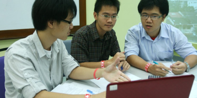  FAMILY TIES (From left): Brothers Dan, David and Daniel Soo bouncing ideas and suggestions off each other for their assignments.