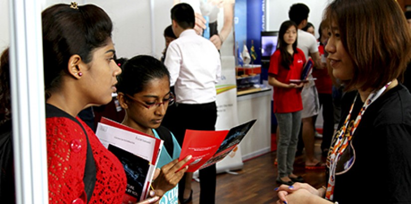  OPPORTUNITIES: Students listen on intently as the representative from the industry explains the career opportunities in her company.