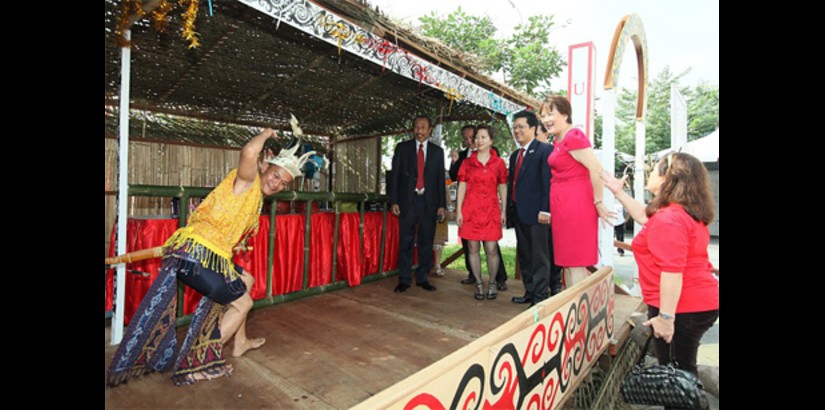  Members of the UCSI Group leadership team witnesses a traditional Iban performance held at the Iban longhouse replica built specially for the Carnival.