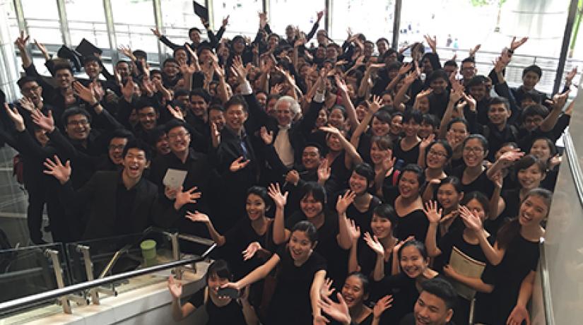  Members of the UCSI Chorale sharing a light moment with Zander (middle).