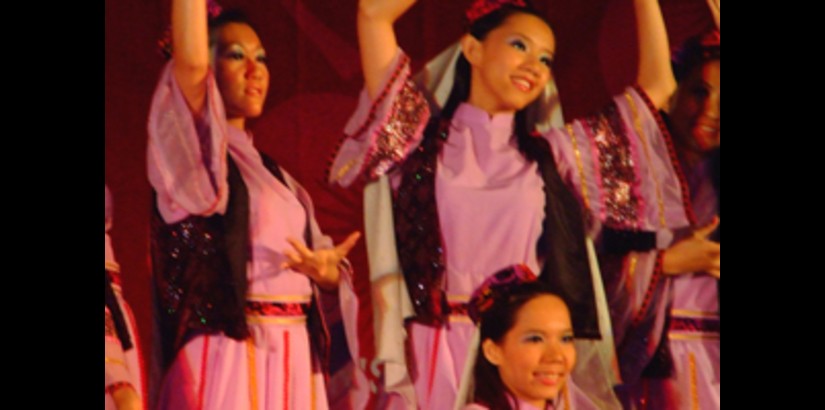 CCS students performing a traditional dance from the Xinjiang county