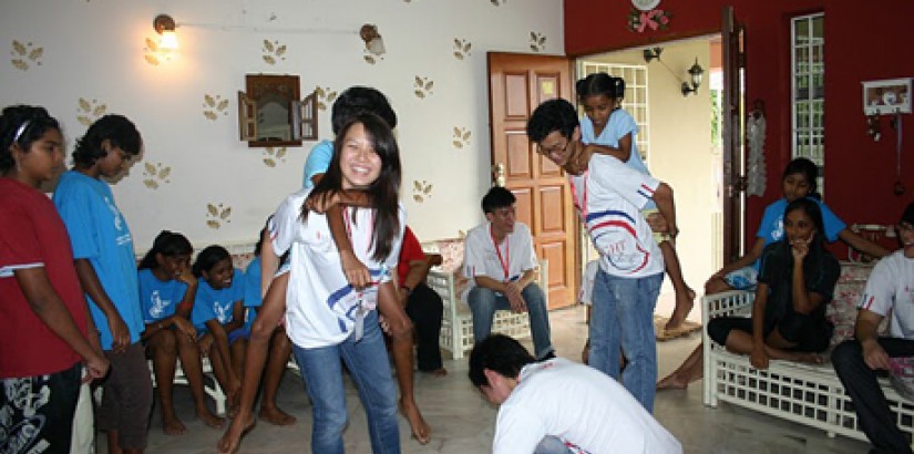 Students and girls of the Destiny Starting Point girls home having fun with UCSI University students during the "Light Up Lives" charity event.