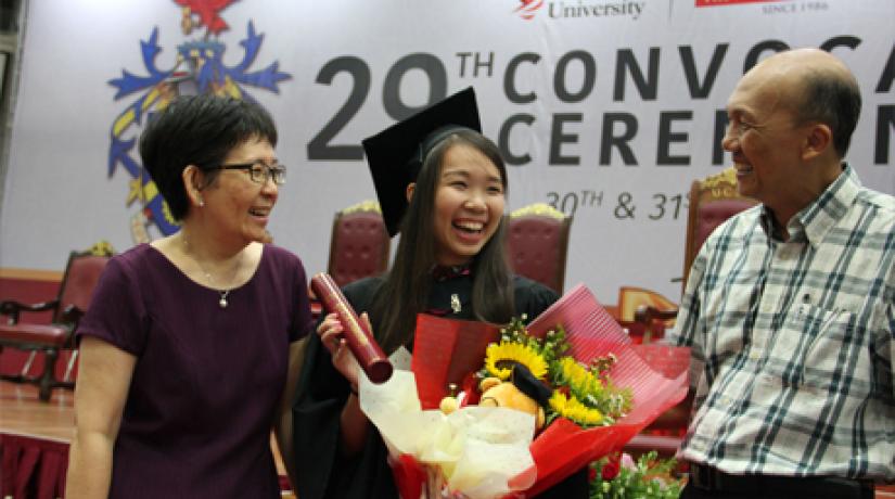 Charis celebrating with her doting parents, Peter Wong and Annie Poh.