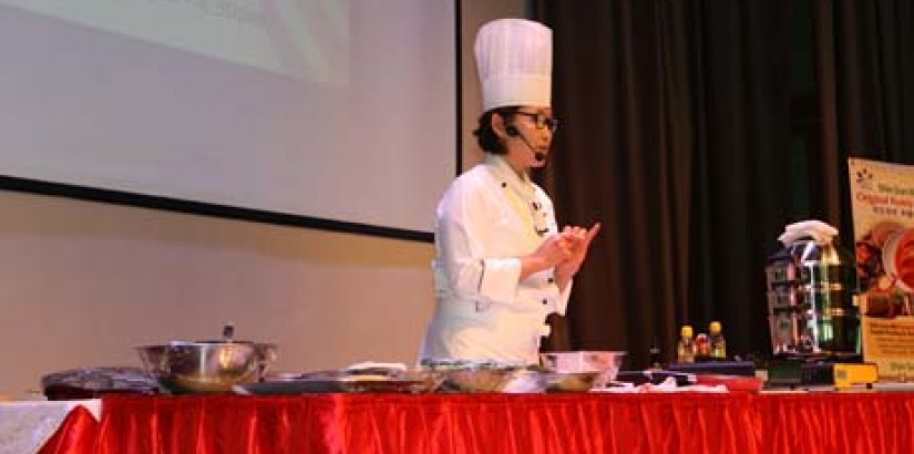Woosong University (Korea) master chef and specialist of Korean royal cuisine Professor Dr Shin Mi Kyung conducting a Korean culinary presentation after the MoU exchange ceremony.