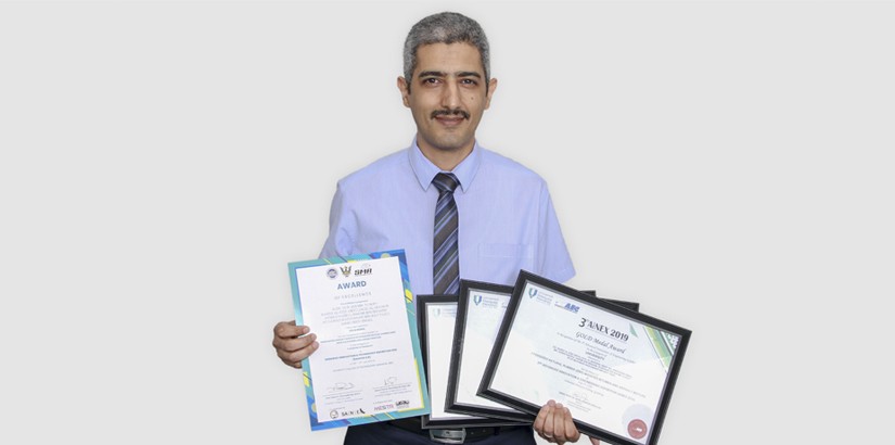 Dr. Ramez holding all certificates of his successful project entitled Epoxidized Natural Rubber (ENR) Modified Bitumen and Asphalt Mixture