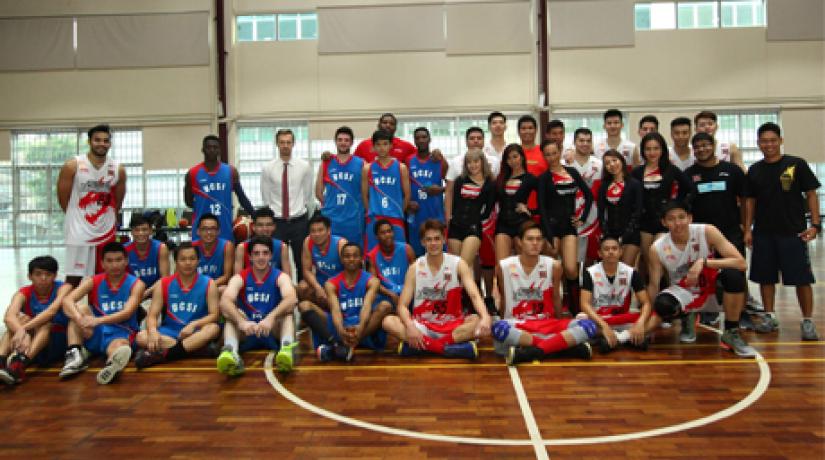 [SPARRING PARTNERS]: After the game, UCSI basketball team (in blue jersey) and Westports Malaysia Dragons struck a pose for the camera.