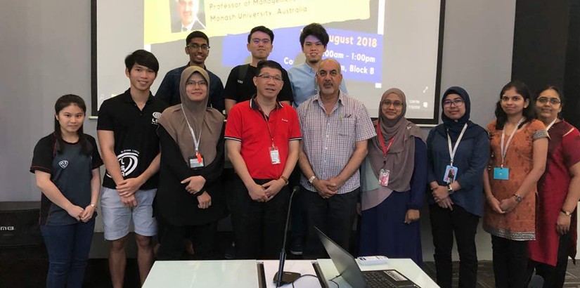 A group photo with Professor Sohal, Faculty of Business and Information Science members and students. 