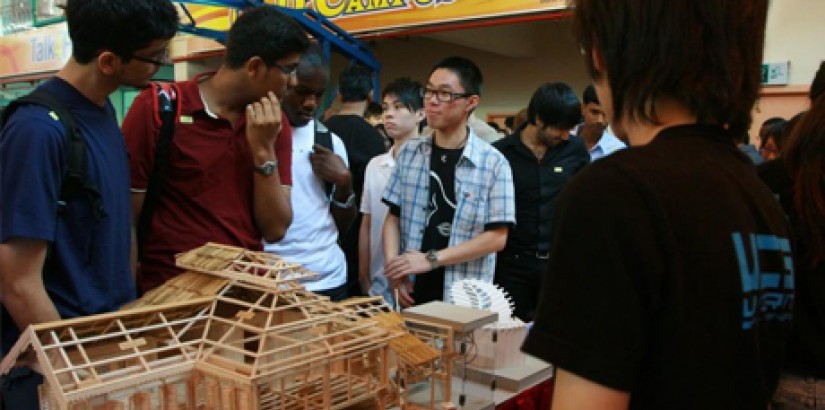 Students taking a tour of the exhibition booths after the Welcome Ceremony. The booths featured research and on-going work done by students and lecturers from various faculties