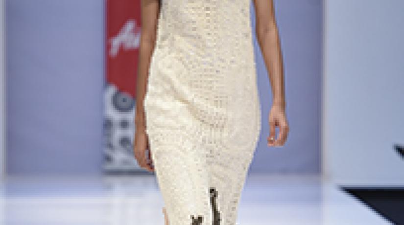 TEXTURE: Unique detailing at the hem was inspired by the huge tree roots at Angkor Wat while the collar of handmade nuno felt mimicked the carvings on the temple walls. TEXTURE: Unique detailing at the hem was inspired by the huge tree roots at Angkor Wat while the collar of handmade nuno felt mimicked the carvings on the temple walls.