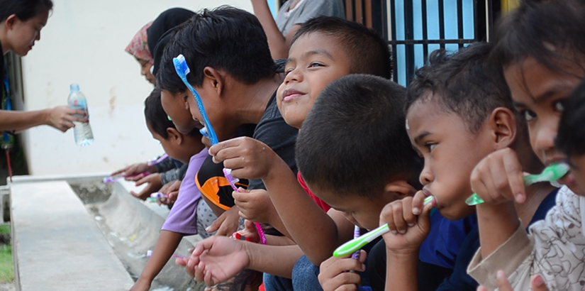 Children enjoying the teeth brushing session.