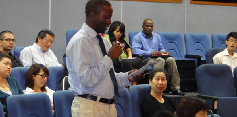 A participant asking question during the Q&A session