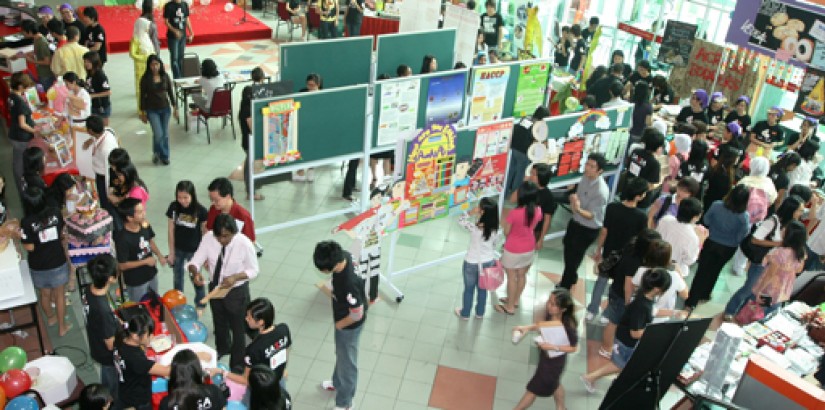 The student area abuzz with activity and students promoting their products