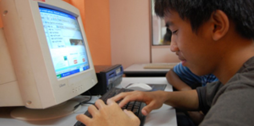 One of the children from Precious Home checking his email at the computer lab