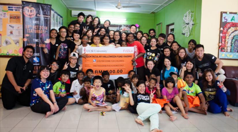  (first row, first from left) Asst Prof Chan with the UCSI mass comm students and children from Shelter at the end of the ‘Spooktacular Halloween – Smiles through Spooks’ event.