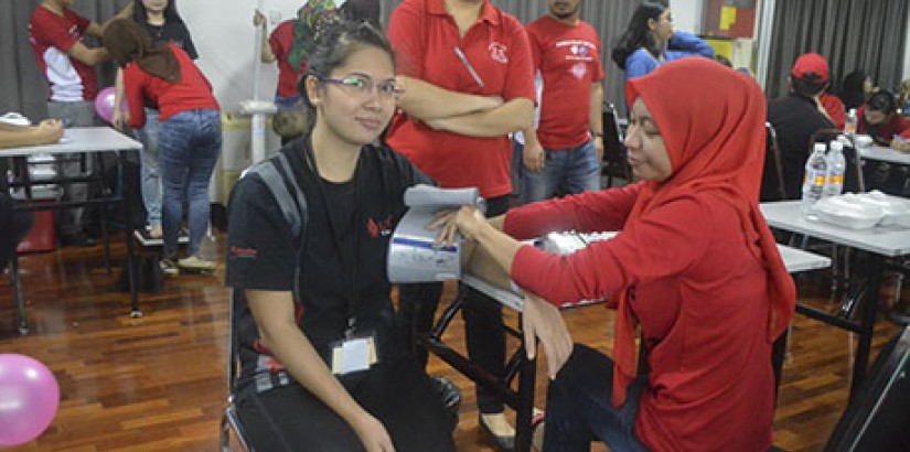  Participants having their free health screening.