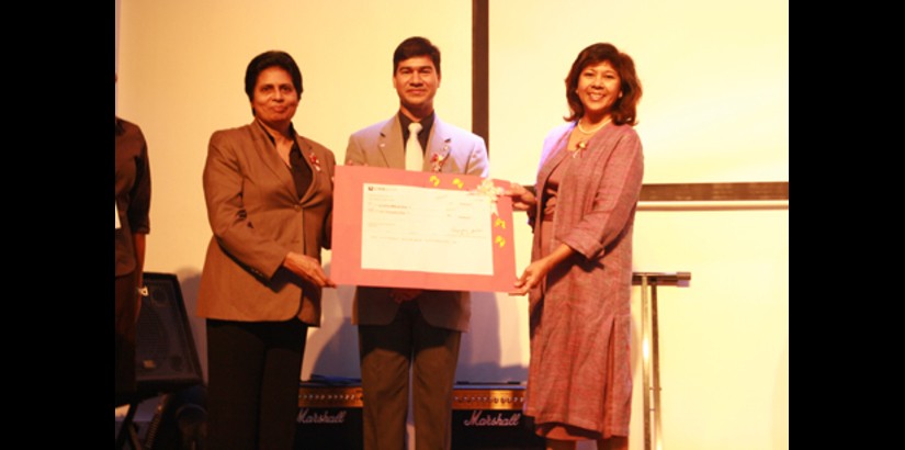  Associate Professor Jeya Devi Coomarasamy presenting the cheque worth RM6000 to Ms Mary Frances Ratnam of Hospis Malaysia while Assoc. Prof. Dr. Lachman Tarachand looks on.