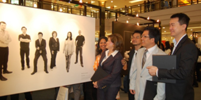 President Peter T. S. Ng (in light-coloured suit) along with the other Honda personas admiring one of the posters during the Honda launch