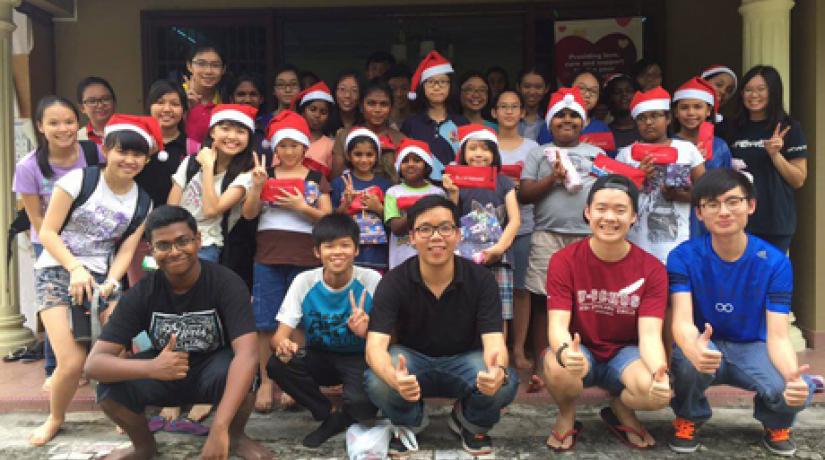 [GROUP PHOTO]: Members of UCSI’s Hope Revive Club and the girls at Rumah Kasih in a group photo.