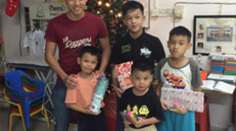  [ALL SMILES]: The boys at Rumah Sayangan smiled for the camera with their Christmas gifts.