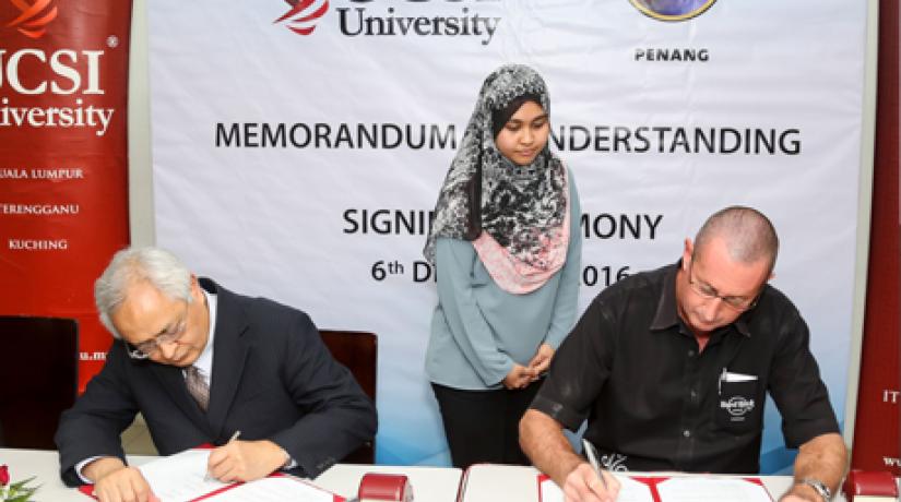 Senior Professor Dato' Dr Khalid Yusoff (left), Vice-Chancellor and President of UCSI University and John Primmer (right), General Manager of Hard Rock Hotel Penang signs the MOU which will see both institutions in a long-term education partnership.