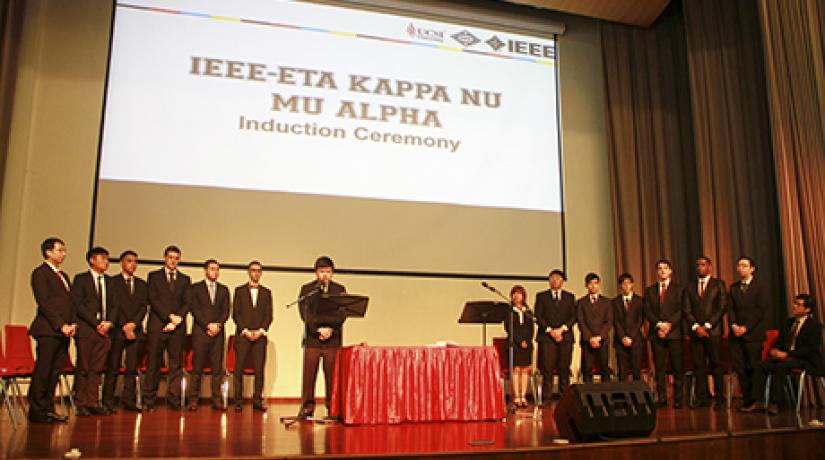  INDUCTION: IEEE-HKN Mu Alpha chapter president Chan Kok Wai (middle) on stage with other charter members and UCSI academics during the induction ceremony.