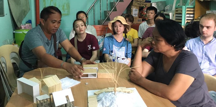 Discussing the design of the hut.