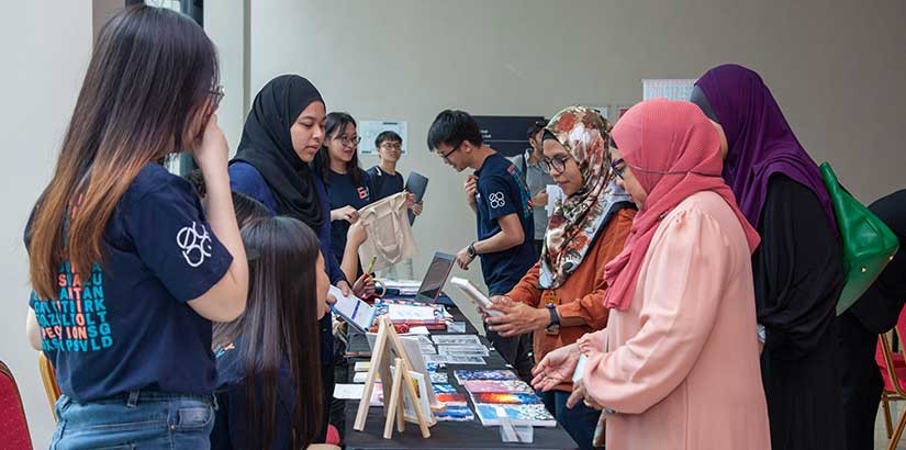 Students at the exhibition booth.