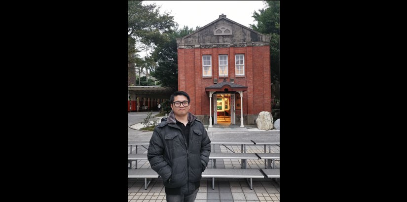 Faculty of Engineering, Technology and Built Environment deputy dean Assistant Professor Ts Dr Lim Wei Hong in front of Red House, an iconic monument in NTUT, Taiwan.