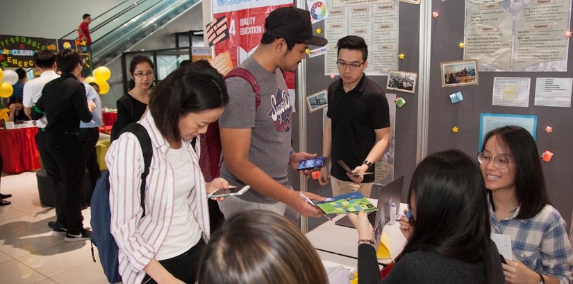 Students visiting the SDG booths.