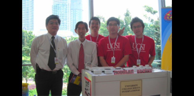 From left: Dr. Jimmy Mok and Roger Tan, with the students