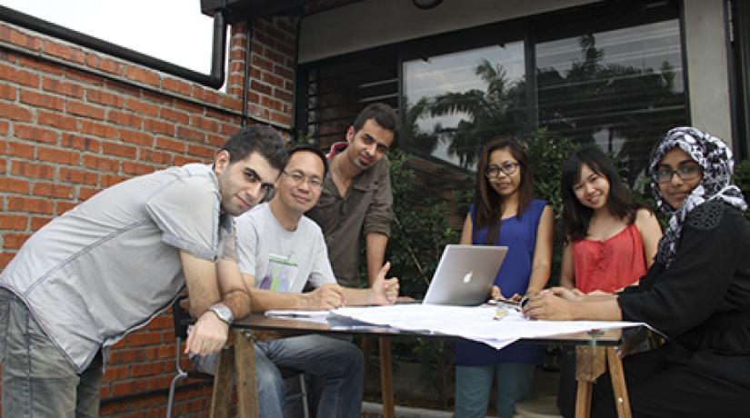  GROUP PORTRAIT (Clockwise from right): Hamda Ibrahim; Hesam Mirsafdari; David Koo; Morteza Bozorgi; and Lam Sook Wan discussing the project at the balcony while Elaine Ng, also a UCSI graduate, looks on.