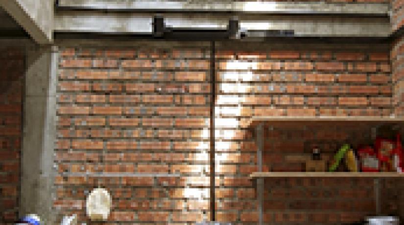  BACK TO BASICS: Plenty of headroom space and natural lighting gives the pantry a spacious feel.