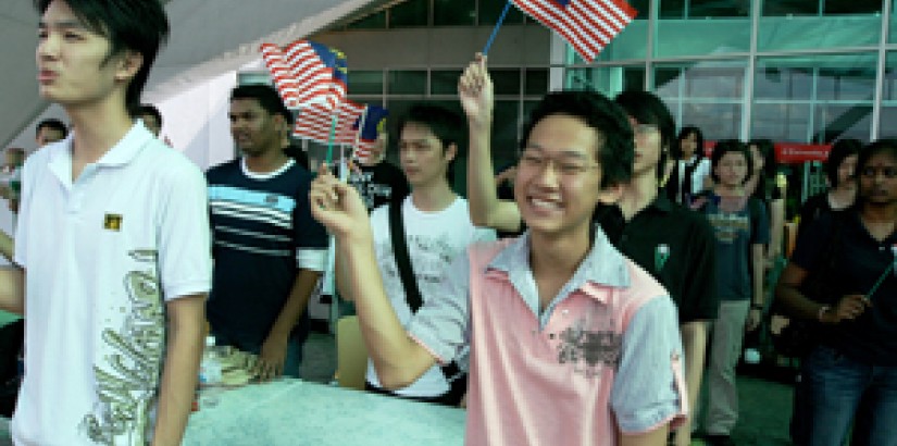 Students Waving Flags in Celebration of Merdeka