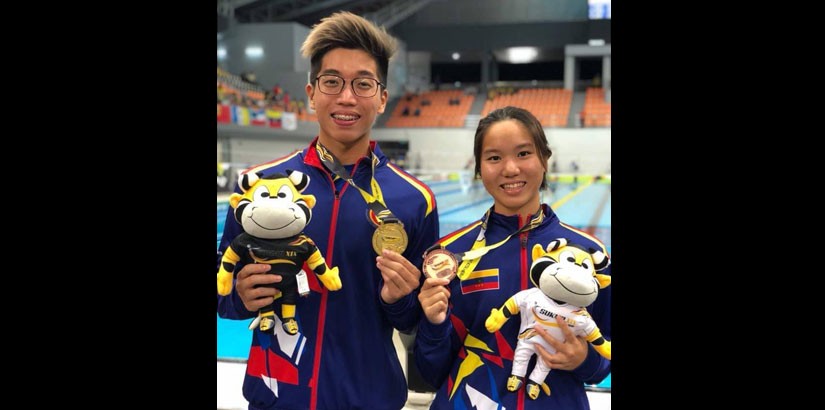 Photo courtesy of Keith Lim – Keith Lim posing with his sister, Karla, at a recent Sukma Games. 