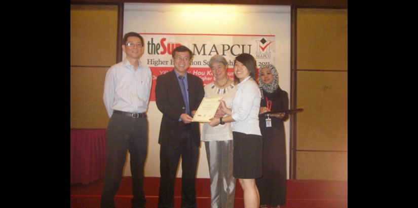  In coming student for September 2011 intake Tan Yanxian posing with the deputy minister of education