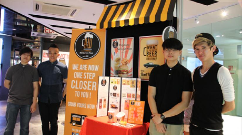[NEW AND IMPROVED]: Year 2 student Lucas Tan (second from left) and his team members chose to recreate A&W’s packaging concept with a modern look that still paid homage to the brand’s signature root beer float.