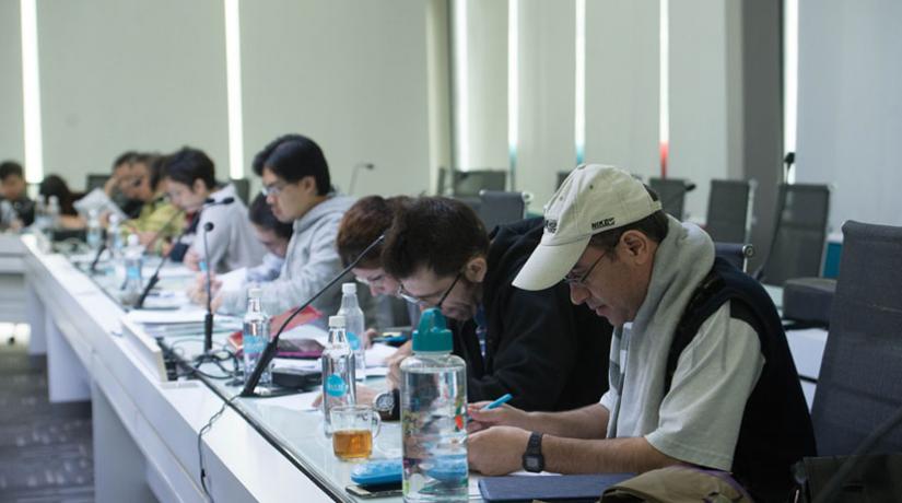 Participants working diligently on preparing a review of the selected journal article