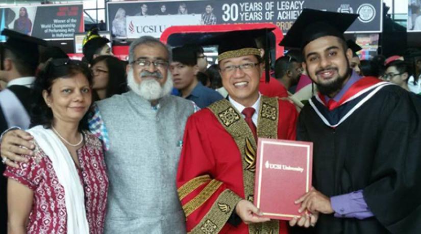 Dr Juzer Abbasi (right) celebrates his graduation with his parents and founder of UCSI University Dato' Peter Ng (second from right).