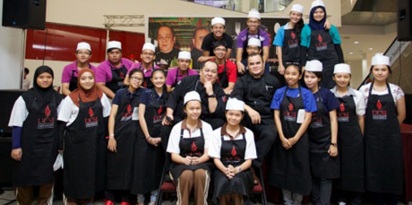  GROUP PORTRAIT: Contestants of the “Next Big Chef” competition strike a group pose for the camera.