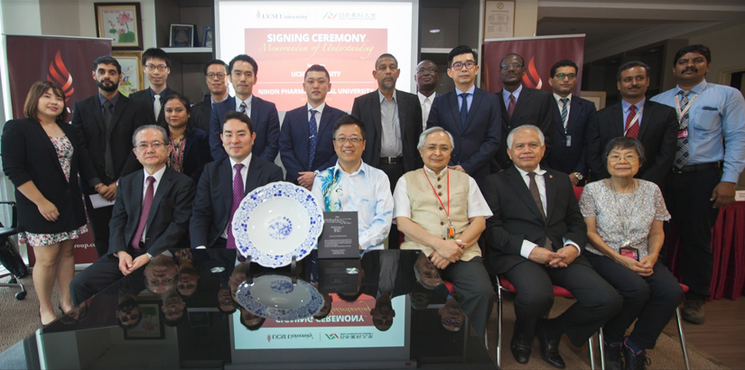 A group photo of members from both universities.