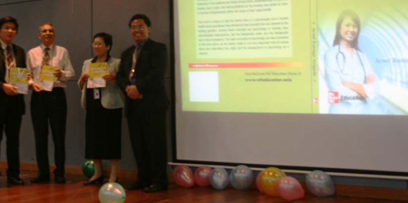 Arnel Banaga Salgado (far right) launches his book together with (from left) Dr. Jimmy Mok, Head for the Centre of Research Excellence, Prof. Dr. Jammal Ahmad bin Essa, Dean for the Faculty of Medical Sciences and Ms. Than Soo Nyet, a lecturer at the Facu
